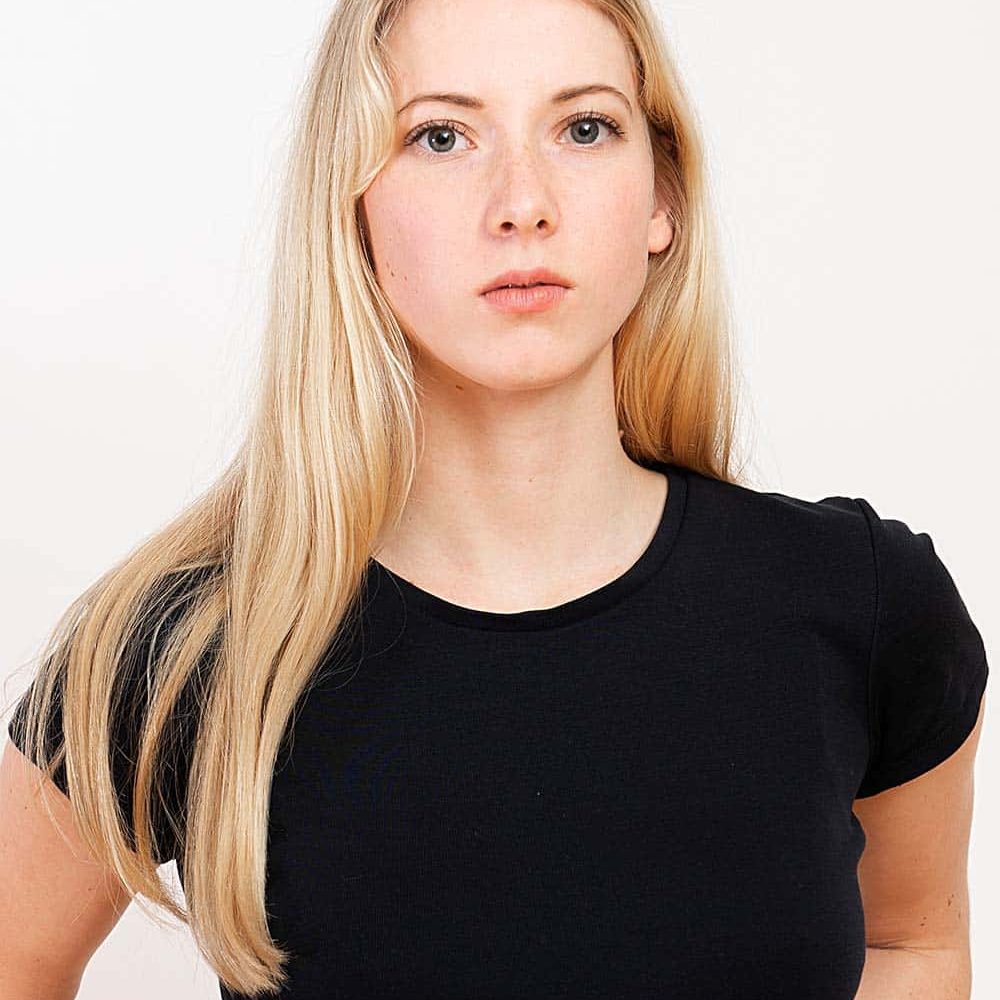 portrait-of-a-young-blonde-woman-isolated-on-a-whi-XQMA6UZ.jpeg